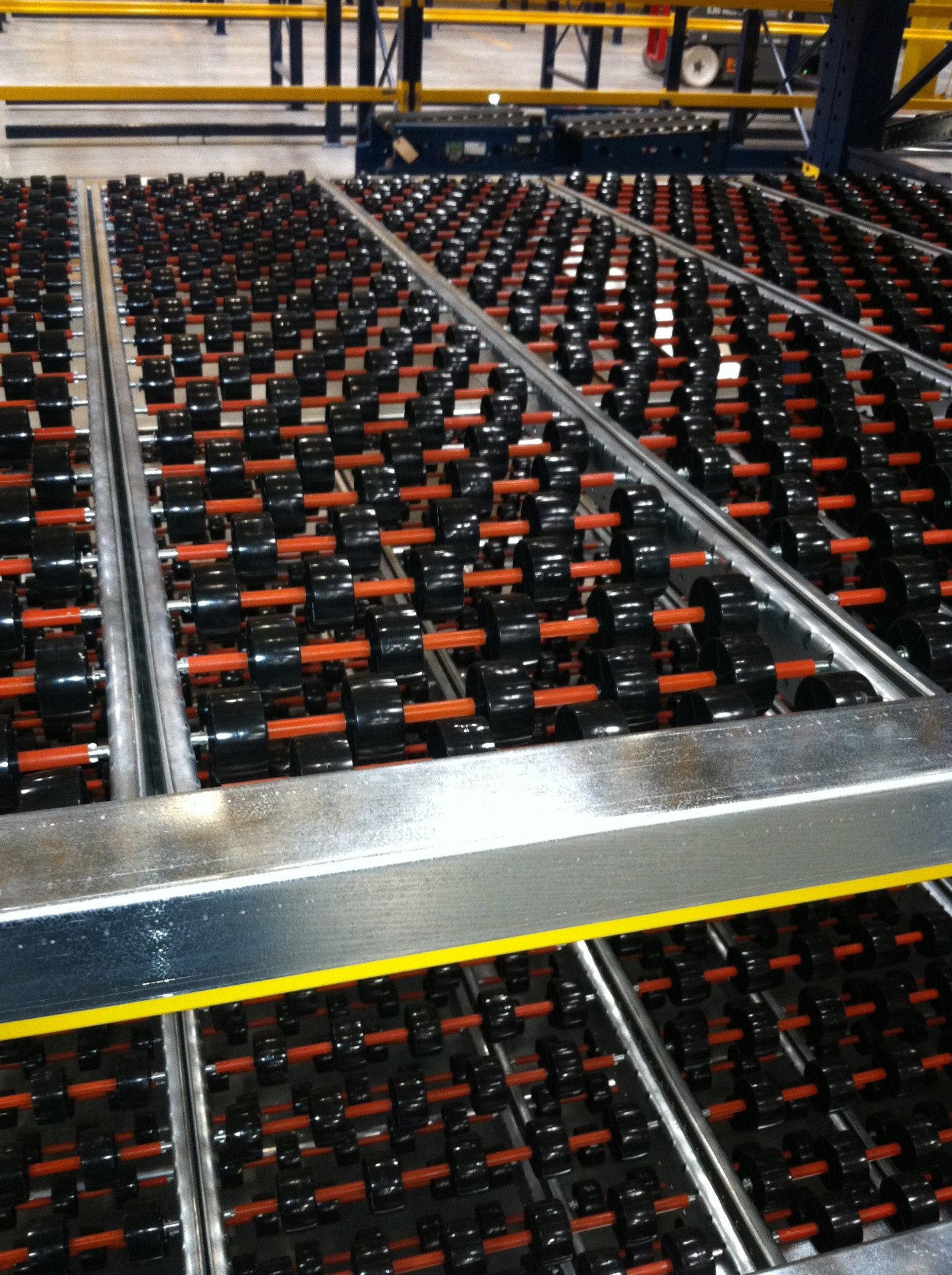 Carton flow rack pick face with cases